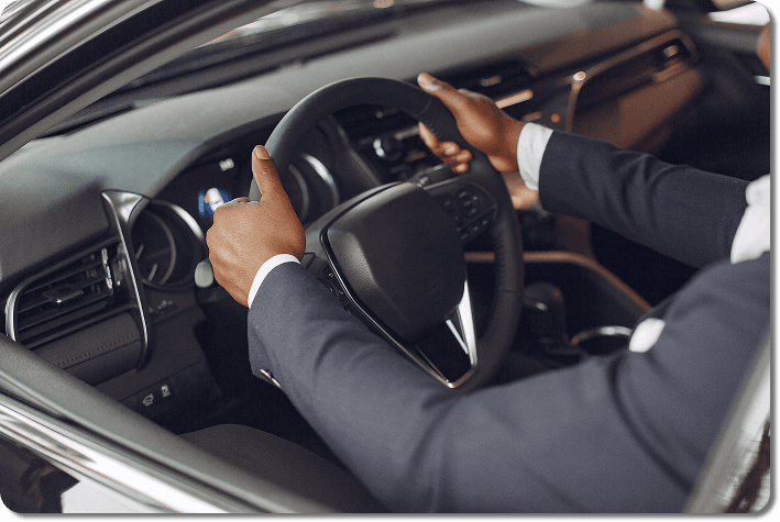 Driver hands on steering wheel
